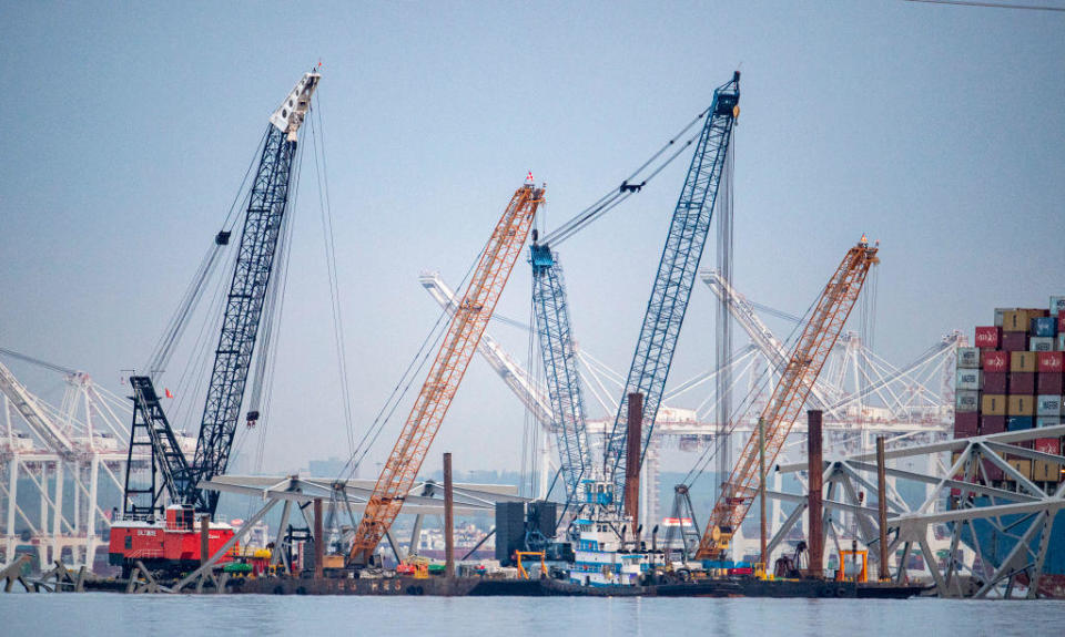 BALTIMORE, MD -APRIL 15:   Cranes work to remove sections of the Key Bridge that are blocking the Chanel into the Port of Baltimore. The FBI has  opened a criminal investigation into the circumstances surrounding the collapse of the Key Bridge after it was struck by the Dali. Officials board the boat on April 15, 2024. / Credit: Jonathan Newton/for The Washington Post via Getty Images