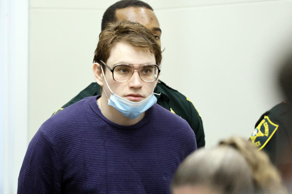 Marjory Stoneman Douglas High School shooter Nikolas Cruz enters the courtroom during the penalty phase of Cruz's trial at the Broward County Courthouse in Fort Lauderdale, Fla. on Tuesday, Sept. 27, 2022. Cruz previously plead guilty to all 17 counts of premeditated murder and 17 counts of attempted murder in the 2018 shootings. (Amy Beth Bennett/South Florida Sun Sentinel via AP, Pool)