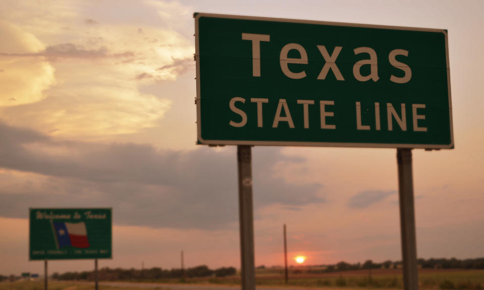 A sign defining the Texas state line
