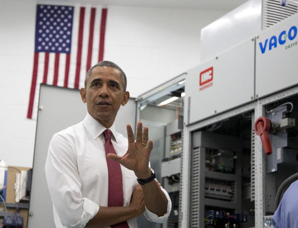 President Barack Obama speaks to media during his tour of Vacon, a research and development center and lab for high-power AC drives, Wednesday, Jan. 15, 2014, in Durham, N.C., before traveling to North Carolina State University where he will speak about the economy, jobs and manufacturing. (AP Photo/Carolyn Kaster)