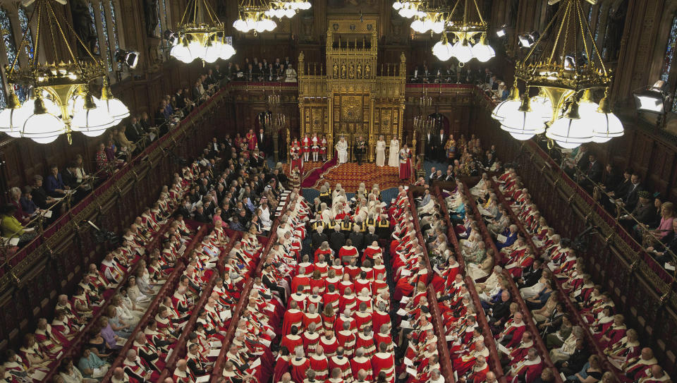 FILE This Wednesday, May 9, 2012 file photo shows Britain's Queen Elizabeth II seated beside Prince Philip in the House of Lords as she waits to read the Queen's Speech to lawmakers in London. Prime Minister David Cameron on Wednesday set out ambitious plans to replace Britain's 700-year-old House of Lords, the country's unelected upper chamber, with a smaller, mostly elected body _ taking on a task that has frustrated political leaders for decades. “We have been discussing this issue for 100 years and it really is time to make progress,” Cameron told legislators, hoping his government can succeed in stripping the country's non-elected elites of a legislative role which has its roots in the 11th Century. (AP Photo/Alastair Grant, Pool)