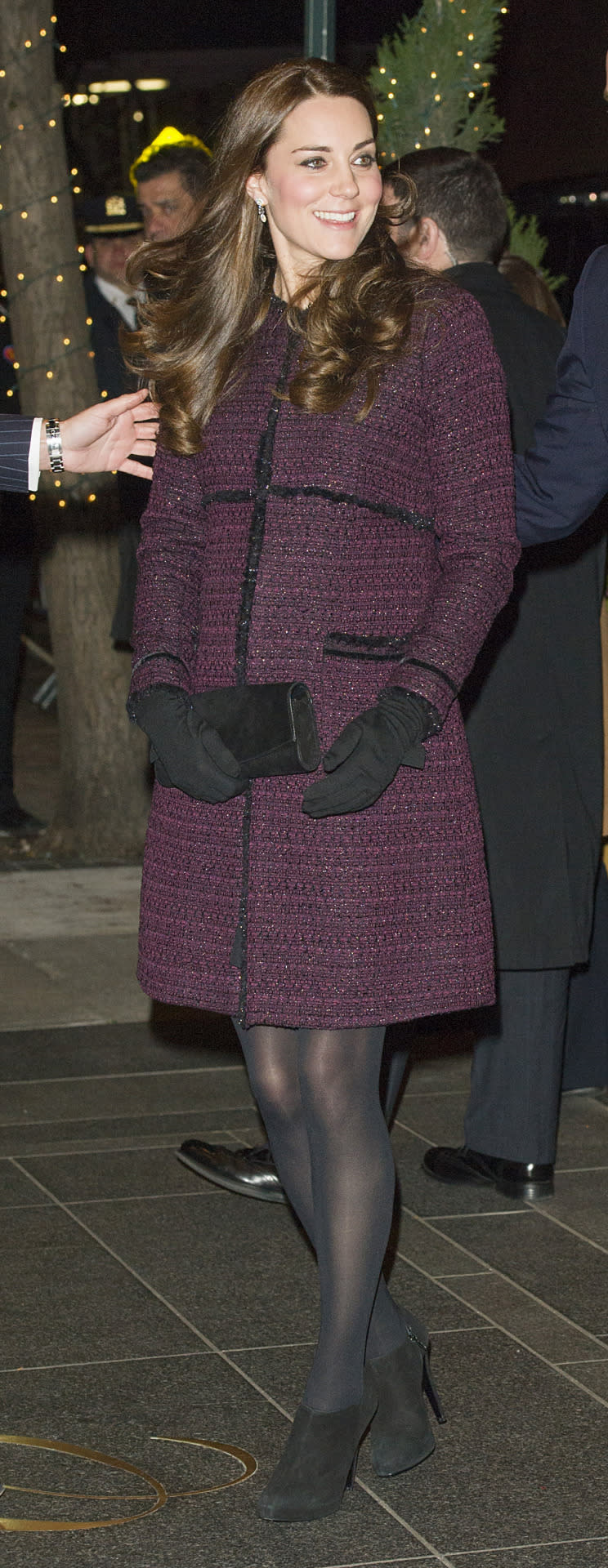<p>Kate opted for a bouclé coat by Seraphine Maternity for her arrival in New York. She carried a black clutch by Stuart Weitzman and wore black booties and wool gloves from Cornelia James.</p><p><i>[Photo: PA]</i></p>