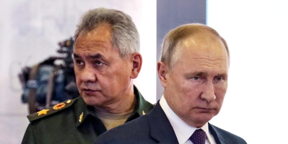 Russian President Vladimir Putin, right, and Russian Defense Minister Sergei Shoigu attend the launch of the construction of new nuclear submarines and other warships via video conference on the side of the International Military Technical Forum Army-2021 in Alabino, outside Moscow, Russia, Monday, Aug. 23, 2021.