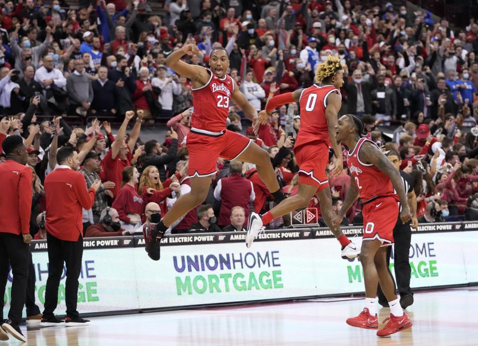 Ohio State Buckeyes forward Zed Key (23) celebrates with guard Meechie Johnson Jr. (0) and guard Cedric Russell (2) following their 71-66 win over the Duke Blue Devils in the NCAA men's basketball game at Value City Arena in Columbus on Wednesday, Dec. 1, 2021.