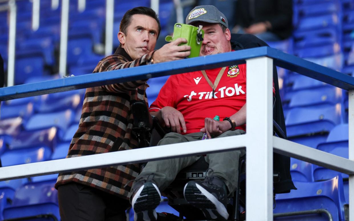 Rob McElhenney, co-owner of Wrexham, takes a selfie with a fan