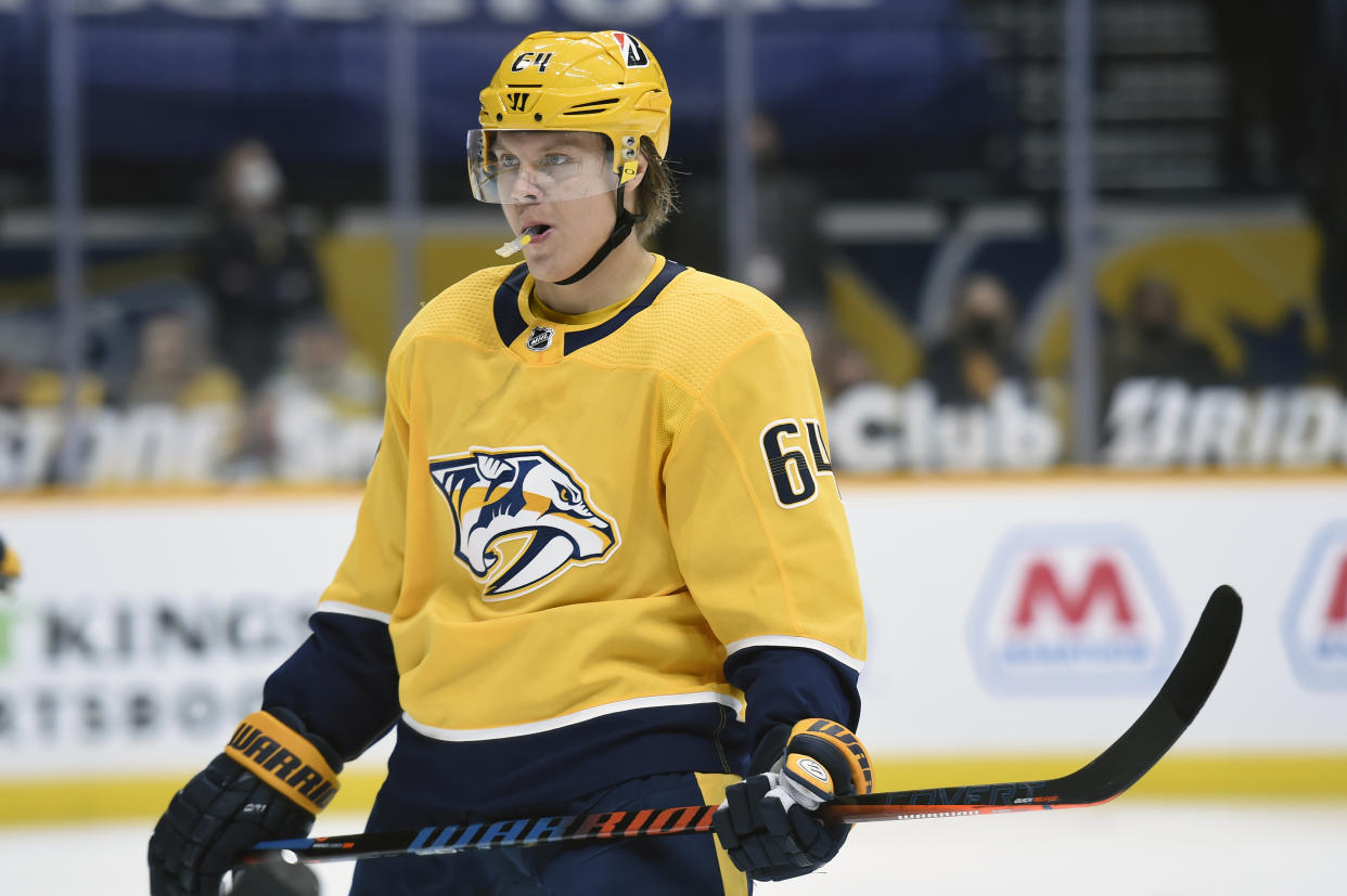 Nashville Predators center Mikael Granlund (64) plays against the Columbus Blue Jackets during first period of an NHL hockey game Saturday, Feb. 27, 2021, in Nashville, Tenn. (AP Photo/Mark Zaleski)