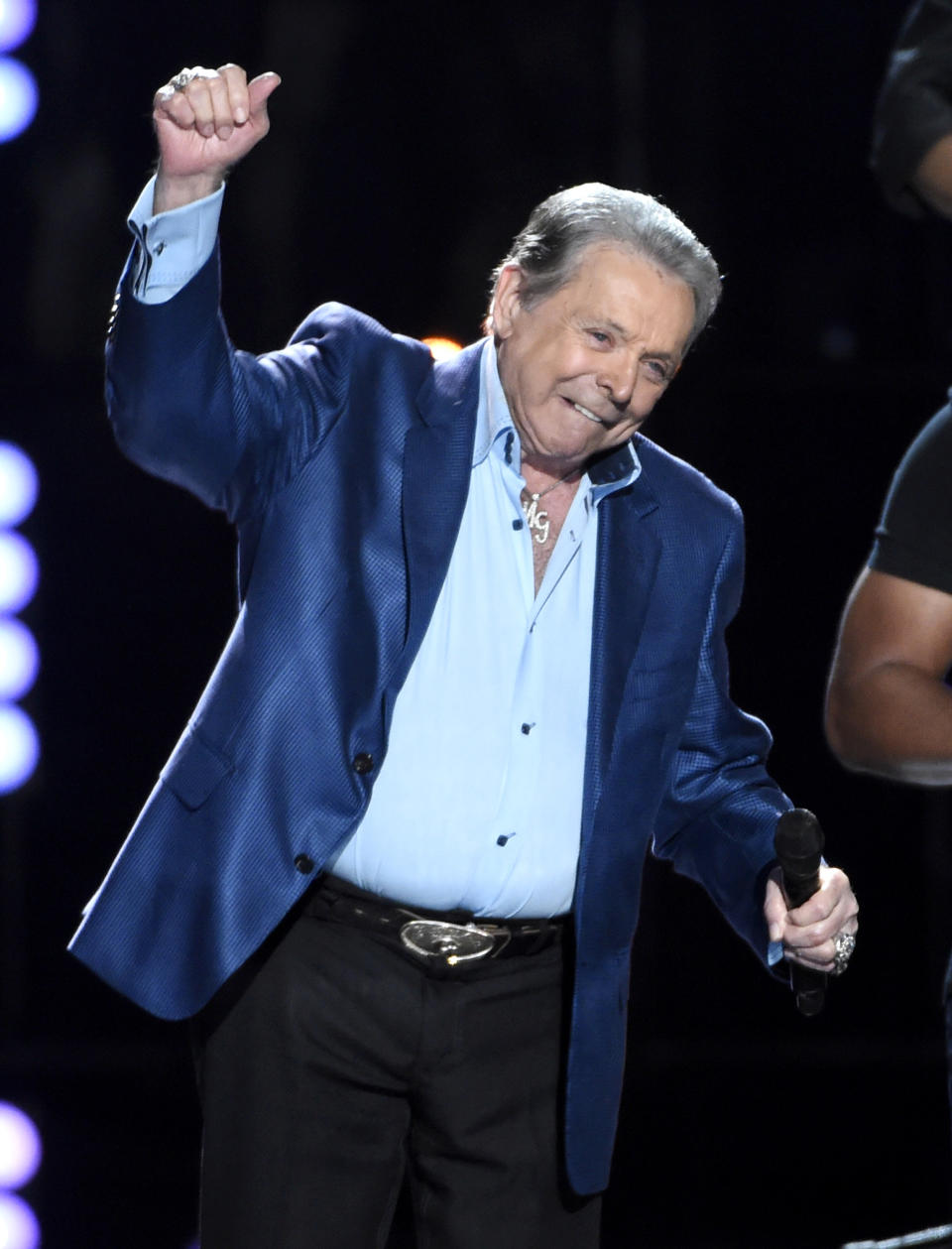 FILE - Mickey Gilley accepts the triple crown award at ACM Presents Superstar Duets at Globe Life Park on Friday, April 17, 2015, in Arlington, Texas. Gilley, whose namesake Texas honky-tonk inspired the 1980 film “Urban Cowboy,” and a nationwide wave of Western-themed nightspots, died Saturday, May 7, 2022, at age 86. (Photo by Chris Pizzello/Invision/AP, File)