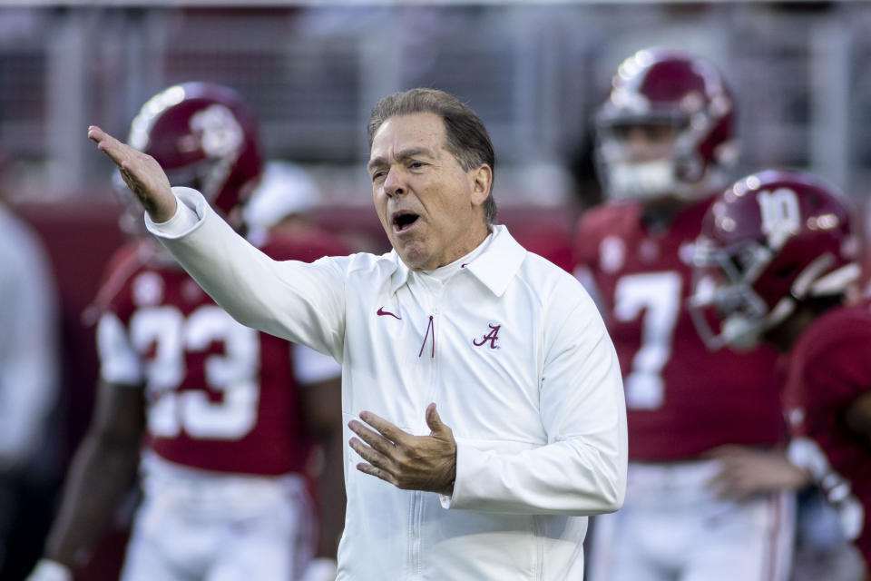FILE - Alabama head coach Nick Saban yells instruction before an NCAA college football game against LSU, Saturday, Nov. 6, 2021, in Tuscaloosa, Ala. The Southeastern Conference spring meetings will be held in person for the first time since 2019 in a little less than two weeks. It is unlikely two of the league's superstar coaches will be chumming around Destin, Florida, together. (AP Photo/Vasha Hunt, File)