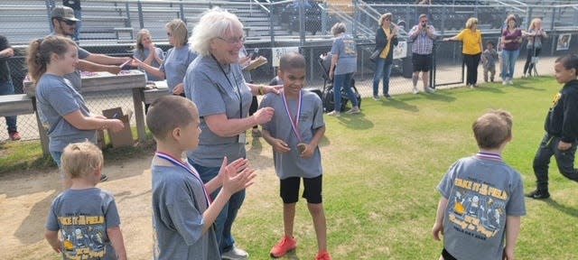 Students received medals during "Take it to the Field" field day in Trenton