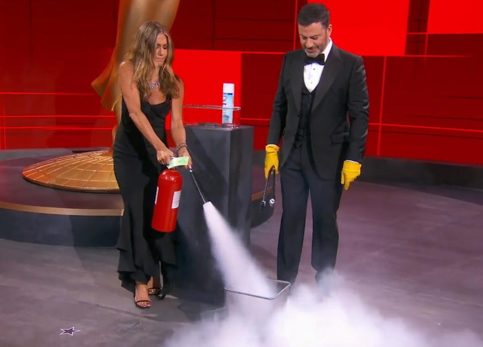 Jennifer Aniston Putting Out a Literal Fire