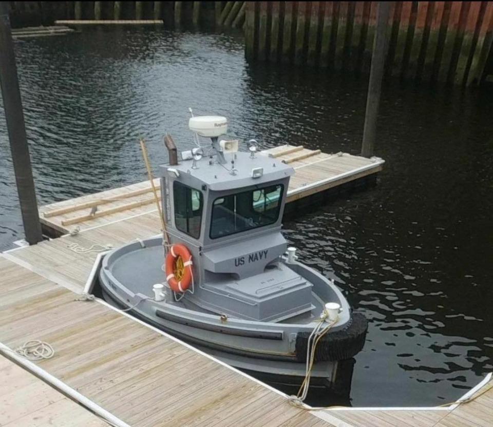 The Boomin' Beaver, a small oval boat, docked