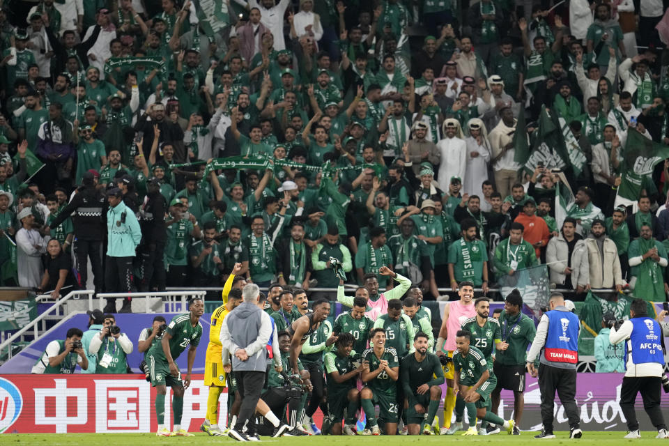 Saudi Arabia players pose after the Asian Cup Group F soccer match between Kyrgyzstan and Saudi Arabia at Ahmad Bin Ali Stadium, in Doha, Qatar, Sunday, Jan. 21, 2024. Saudi Arabia won 2-0. (AP Photo/Aijaz Rahi)