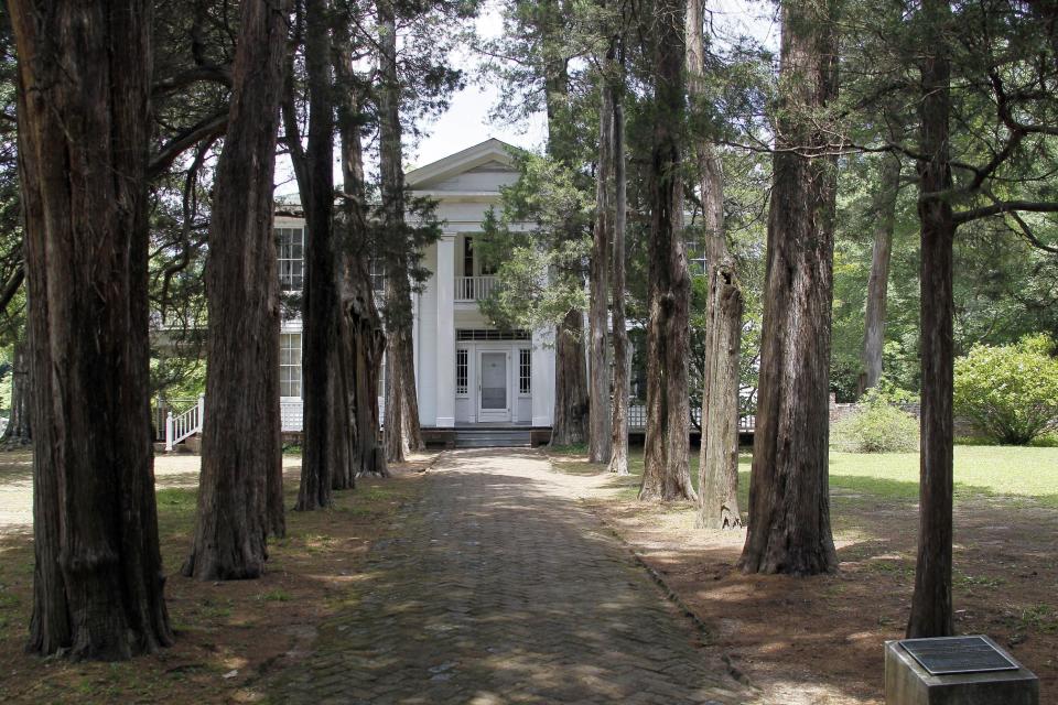 In this June 8, 2012 photograph, Roan Oak, the home of the late Nobel Prize laureate William Faulkner, in Oxford, Miss., is a prime tourist attraction in the community. Designated a National Historical Landmark, the home is now owned and maintained by the University of Mississippi as a museum and is open to visitors year round, allowing a glimpse into the writer's complex life. (AP Photo/Rogelio V. Solis)