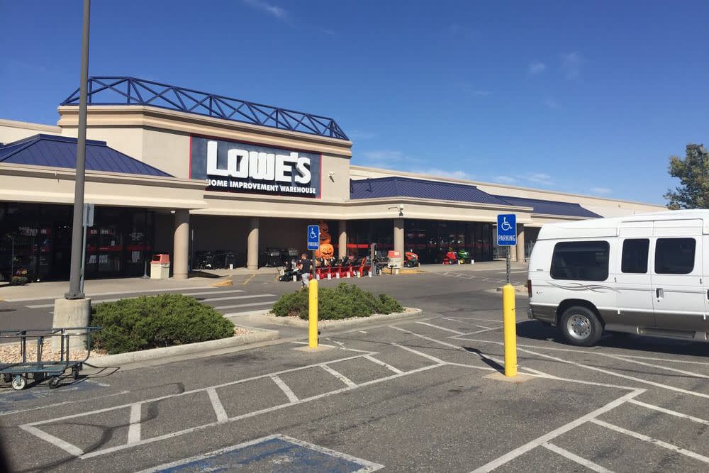 RV van parking in parking lot in front of Lowe's store