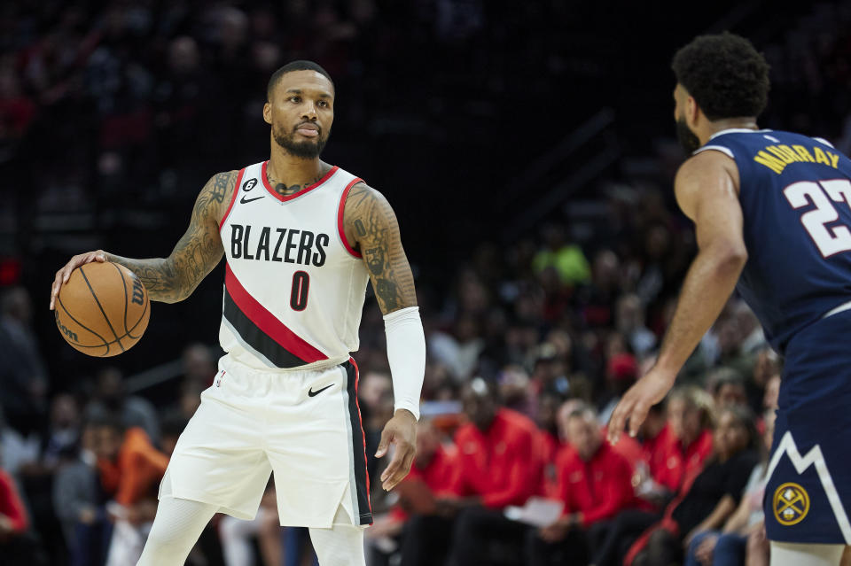 Portland Trail Blazers guard Damian Lillard brings the ball up court against the Denver Nuggets during the second half of an NBA basketball game in Portland, Ore., Monday, Oct. 24, 2022. (AP Photo/Craig Mitchelldyer)