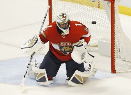 Oct 12, 2017; Sunrise, FL, USA; Florida Panthers goalie Roberto Luongo (1) makes a save in the third period of a game against the St. Louis Blues at BB&T Center. Robert Mayer-USA TODAY Sports