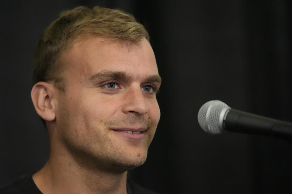 Eric Holt responds to questions during a news conference before the U.S. Olympic Track and Field Trials, Thursday, June 20, 2024, in Eugene, Ore. Holt will compete in the 800m and 1500m races. (AP Photo/George Walker IV)