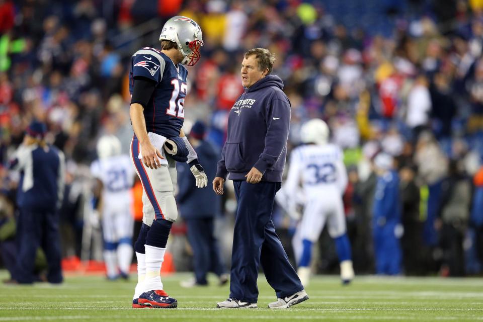 FOXBORO, MA - JANUARY 18:  Tom Brady #12 of the New England Patriots talks with head coach Bill Belichick prior to the 2015 AFC Championship Game against the Indianapolis Colts at Gillette Stadium on January 18, 2015 in Foxboro, Massachusetts.  (Photo by Jim Rogash/Getty Images)