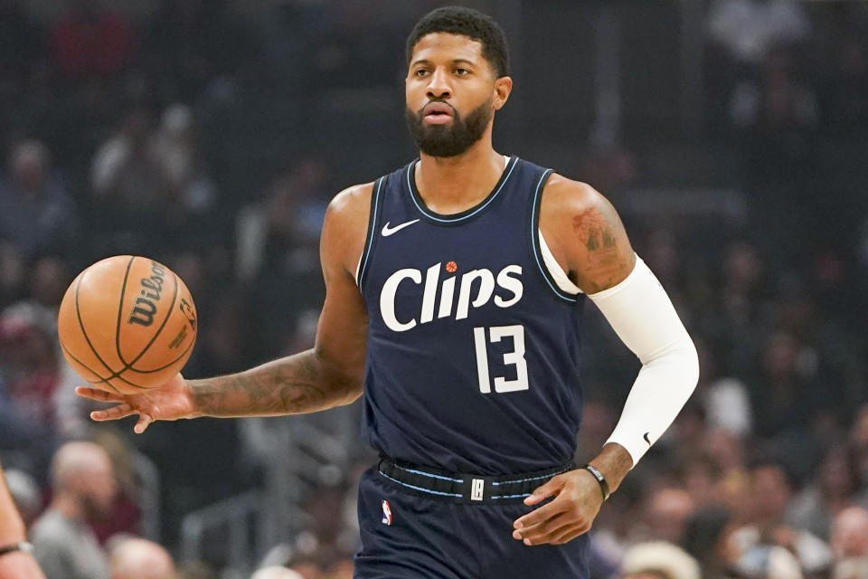 LA Clippers forward Paul George brings the ball up court during the first half of an NBA basketball game against the Memphis Grizzlies, Sunday, Nov. 12, 2023, in Los Angeles. (AP Photo/Ryan Sun)