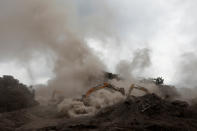 <p>Rescue workers work with excavators at an area affected by the eruption of the Fuego volcano at San Miguel Los Lotes in Escuintla, Guatemala, June 6, 2018. REUTERS/Carlos Jasso – RC1C2F761FB0 </p>