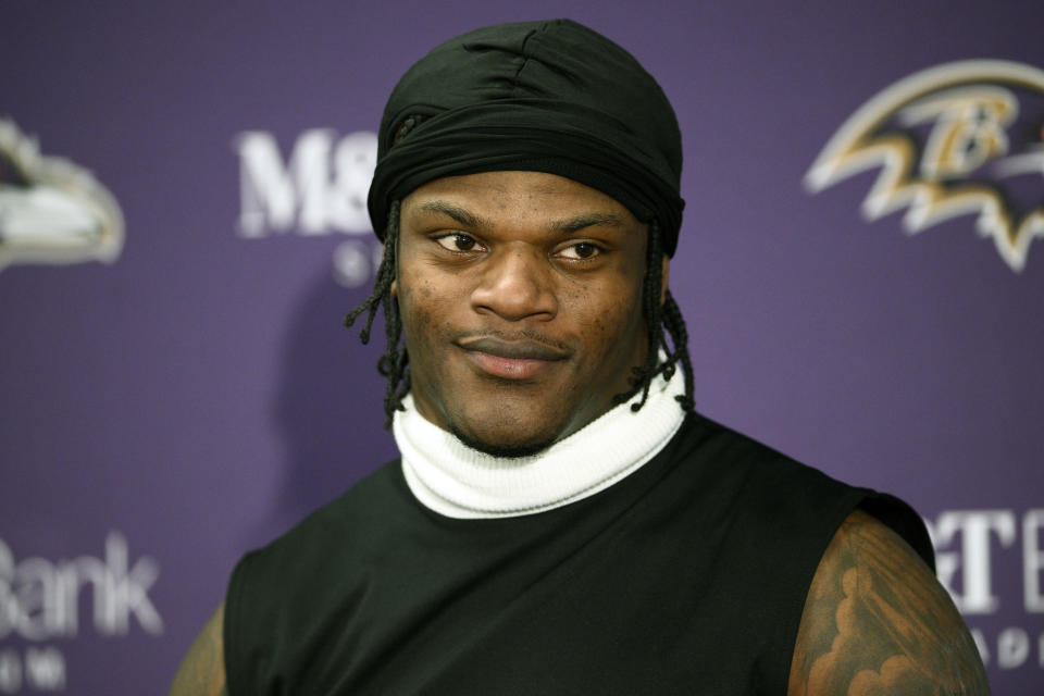 FILE - Baltimore Ravens quarterback Lamar Jackson speaks during a news conference after an AFC divisional NFL football playoff game against the Houston Texans, Saturday, Jan. 20, 2024, in Baltimore. Lamar Jackson is a finalist for The Associated Press 2023 NFL Most Valuable Player and Offensive Player of the Year awards. The winners will be announced at NFL Honors on Feb. 8.(AP Photo/Nick Wass, File)