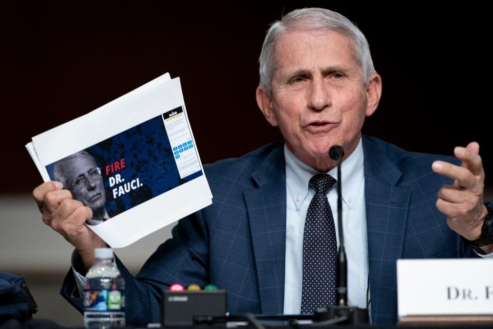 Dr. Anthony Fauci, White House chief medical adviser and director of the NIAID, shows a screengrab of a campaign website while answering questions from Sen. Rand Paul, R-Ky., during a Senate Health, Education, Labor, and Pensions Committee hearing to examine the federal response to COVIA-19 and new emerging variants on Jan. 11. 