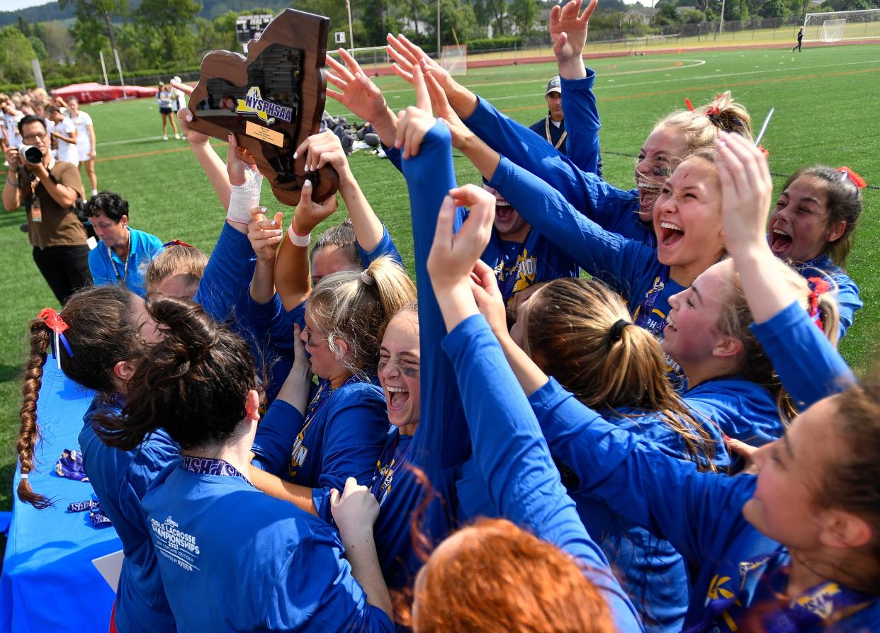 Fairport celebrates their win in the NYSPHSAA Girls Lacrosse Championships Class A final in Cortland, N.Y., Saturday, June 10, 2023.  Fairport won the Class A title with an 10-9 double overtime win over Massapequa.