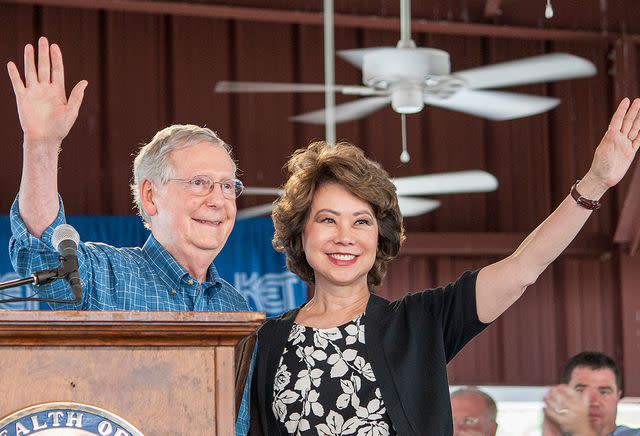 <p>Kat Russell/The Paducah Sun/AP</p> Mitch McConnell and Elaine Chao make a surprise appearance at the 137th annual Fancy Farm Picnic on August 5, 2017.