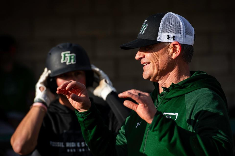 Fossil Ridge head baseball coach Marc Wagner instructs the team during a practice on April 10 at Fossil Ridge High School in Fort Collins.