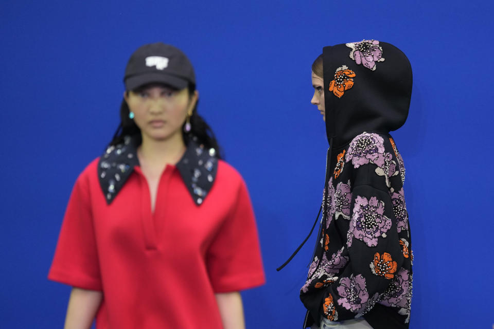 Models wear creations as part of the Dhruv Kapoor men's and women's Spring Summer 2024 collection, unveiled during the Fashion Week in Milan, Italy, Monday, June 19, 2023. (AP Photo/Antonio Calanni)