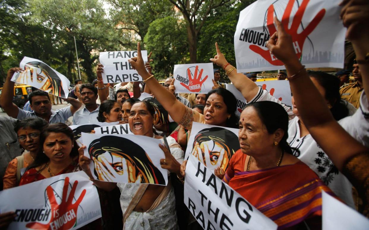 Supporters of Republican Party of India shout slogans during a protest against the rape of a photo journalist in Mumbai in 2013 - Reuters