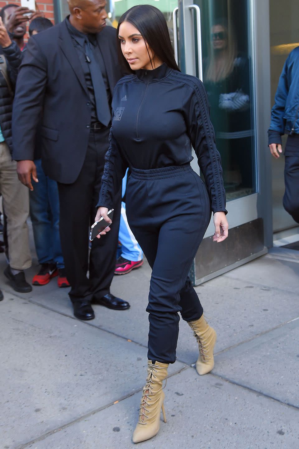 <p>In an black Adidas x Yeezy track jacket with sweatpants and lace-up ankle booties while out in New York City. </p>