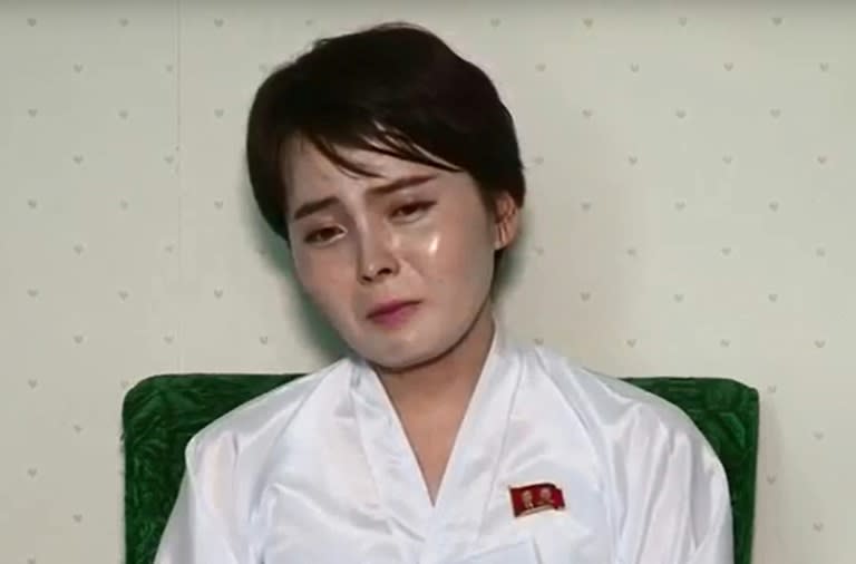 Wearing a traditional silk hanbok and red badge bearing the images of the North's two former leaders, Lim Ji-Hyun tearfully detailed her "miserable" life in the capitalist South where "money is all that matters" 