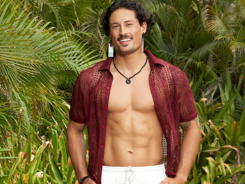 Brayden Bowers poses in white shorts and an unbuttoned red shirt on season 9 of "Bachelor in Paradise."