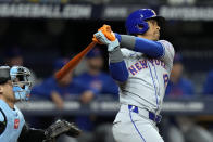 New York Mets' Francisco Lindor watches his two-run double off Tampa Bay Rays starting pitcher Aaron Civale during the fifth inning of a baseball game Friday, May 3, 2024, in St. Petersburg, Fla. (AP Photo/Chris O'Meara)