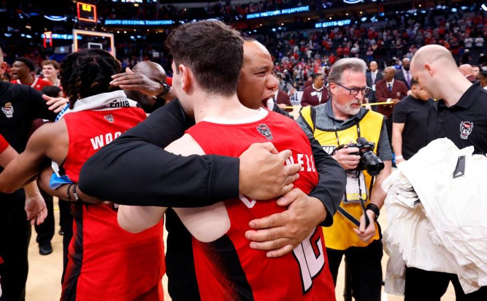 N.C. State head coach Kevin Keatts hugs Michael O’Connell (12) after the Wolfpack’s 76-64 victory over Duke in their NCAA Tournament Elite Eight matchup at the American Airlines Center in Dallas, Texas, Sunday, March 31, 2024.