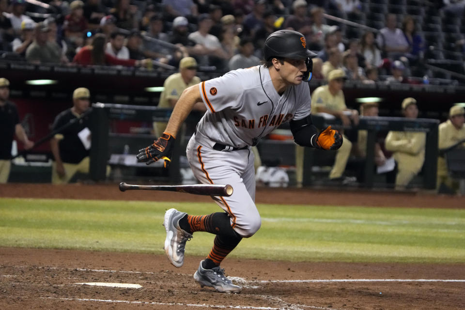 San Francisco Giants' Casey Schmitt leaves the batter's box on an RBI double against the Arizona Diamondbacks during the eighth inning of a baseball game Friday, May 12, 2023, in Phoenix. (AP Photo/Rick Scuteri)