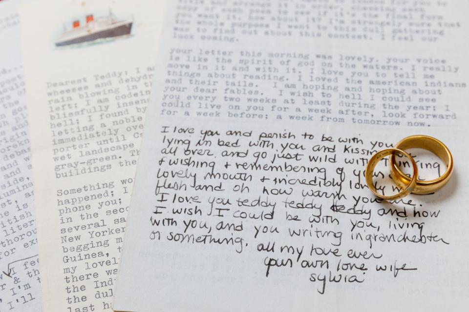 Notes written by Sylvia Plath to her husband, Ted Hughes, along with their matching gold wedding bands (PA)