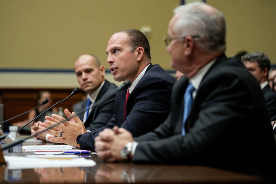 From left, Ryan Graves, David Grusch and David Fravor testify before a House subcommittee about unidentified anomalous phenomena on July 26, 2023, in Washington, D.C. / Credit: Drew Angerer / Getty Images
