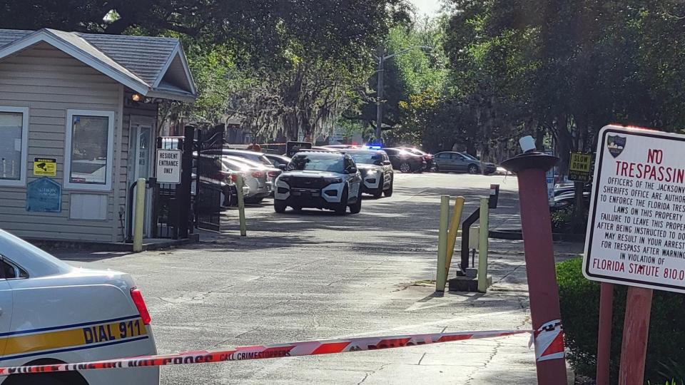 Detectives swarm the south corner of the River City Landing apartment complex at 2681 University Blvd. N. across from Jacksonville University for a deadly triple shooting.