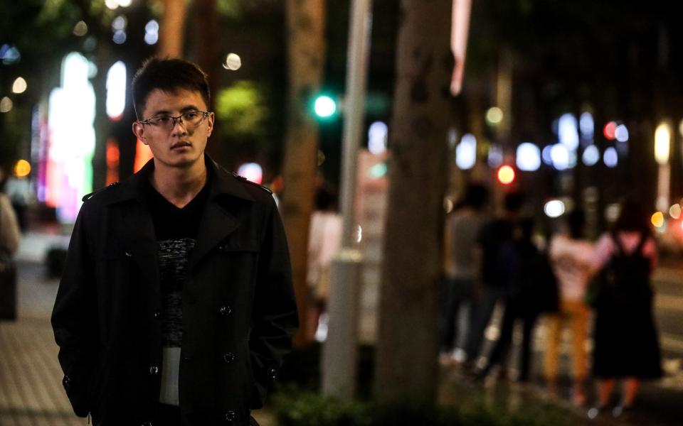 Wei Pin Yang, one of Taiwanese human trafficking victims from Cambodia, walking on a street on August 26, 2022 in Taipei, Taiwan - I-HWA CHENG 