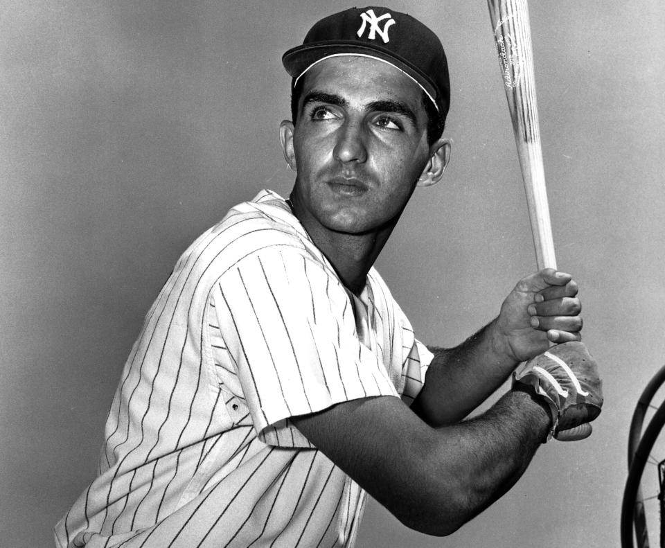 FILE - New York Yankees' Joe Pepitone holds a baseball bat in New York, March 10, 1962. Pepitone, a key figure on the 1960s Yankees who gained reknown for his flamboyant personality, has died at age 82. He was living with his daughter Cara Pepitone at her house in Kansas City, Mo., and was found dead Monday, March 13, 2023, according to BJ Pepitone, a son of the former player. (AP Photo/File)