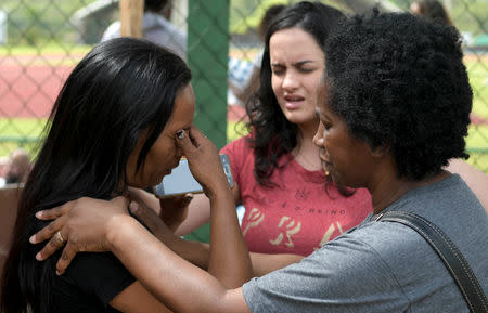 Relatives of people affected by a burst tailings dam owned by Brazilian miner Vale SA react, in Brumadinho, Brazil January 27, 2019. REUTERS/Washington Alves