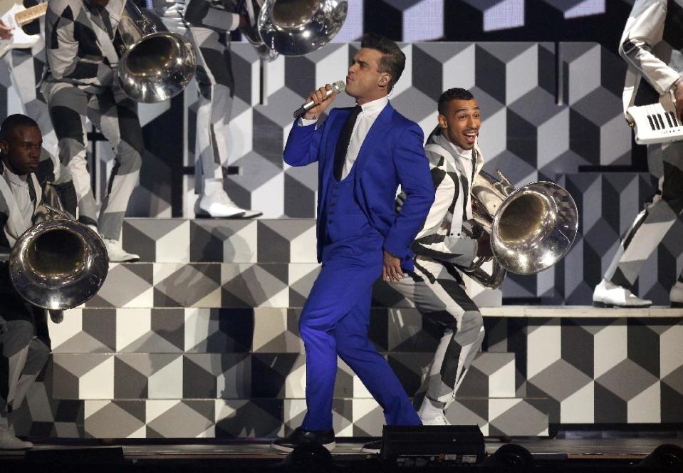 Robbie Williams performs on stage during the BRIT Awards 2013 at the o2 Arena in London on Wednesday, Feb. 20, 2013. (Photo by Joel Ryan/Invision/AP)