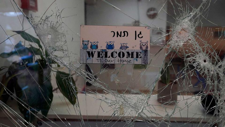 PHOTO:A bullet-shuttered window of the entrance to a kindergarten is seen in Kibbutz Be'eri, Oct. 11, 2023. (Baz Ratner/AP)