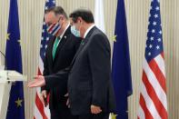 U.S. Secretary of State Mike Pompeo, left, Cypriot President Nicos Anastasiades leave after a press conference at the Presidential Palace in Nicosia, Cyprus, Saturday, Sept. 12, 2020. Pompeo's lightning visit to Cyprus aimed to de-escalate a confrontation between Greece and Turkey over energy reserves in east Mediterranean waters and to affirm Washington's continued engagement in the tumultuous region four days after Russian Foreign Minister Sergey Lavrov pitched Moscow's offer to help ease tensions during his trip to the island nation. (AP Photo/Petros Karadjias, Pool)