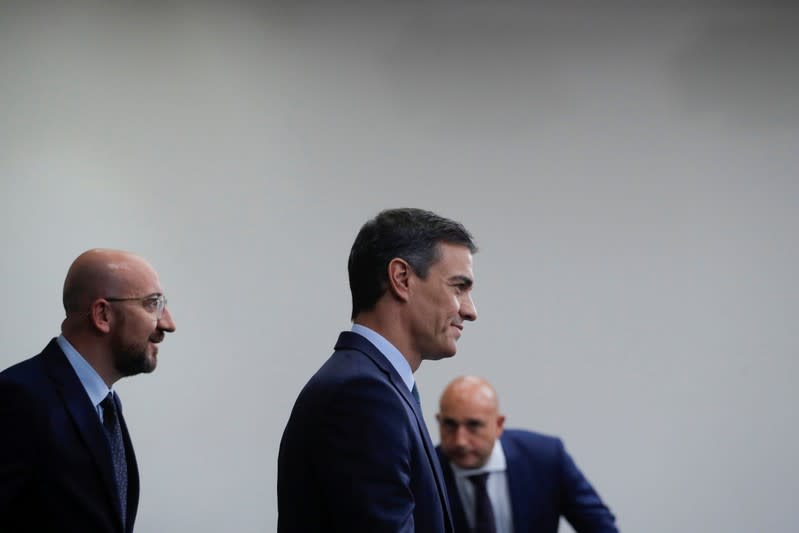 Spain's acting Prime Minister Pedro Sanchez and European Council president-elect Charles Michel arrive for a news conference at the Moncloa Palace, in Madrid