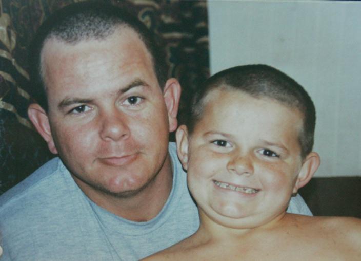 Slain Lake County Deputy Wayne Koester, left, is shown in an undated family photo with his son, Ryan.