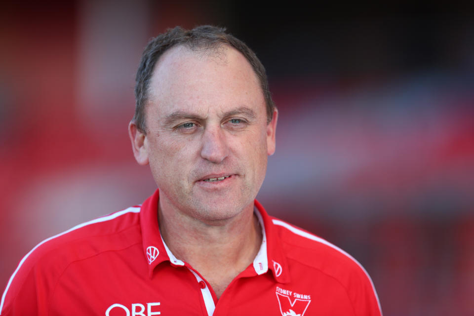  John Longmire smiling before a match.