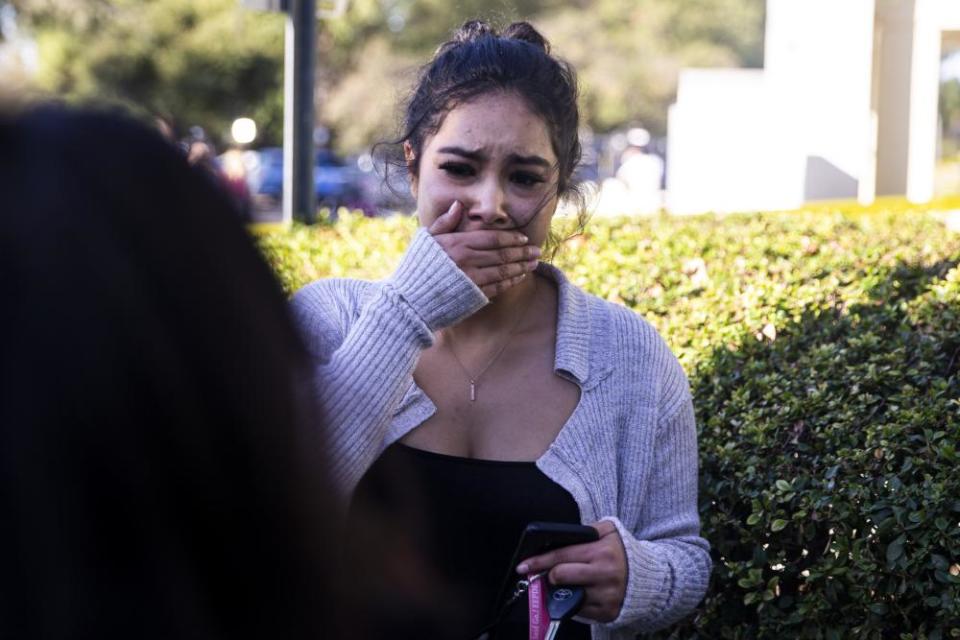 A woman waits for news about a missing loved one after the shooting in Thousand Oaks.